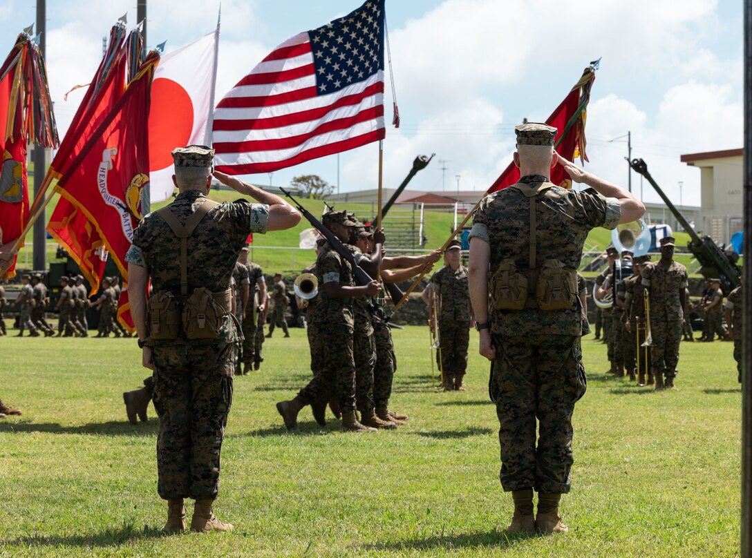 U.S. Marine Corps Maj. Gen. Jay Bargeron, right, passes the 3d Marine Division colors to Maj. Gen. Christian Wortman during a change of command ceremony on Camp Courtney, Okinawa, Japan, June 30, 2023. The ceremony signified the official transfer of command of 3d Marine Division from Maj. Gen. Bargeron to Maj. Gen. Wortman. (U.S. Marine Corps photo by Sgt. Jennifer Andrade)