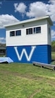 Photo of a blue and white brick building.