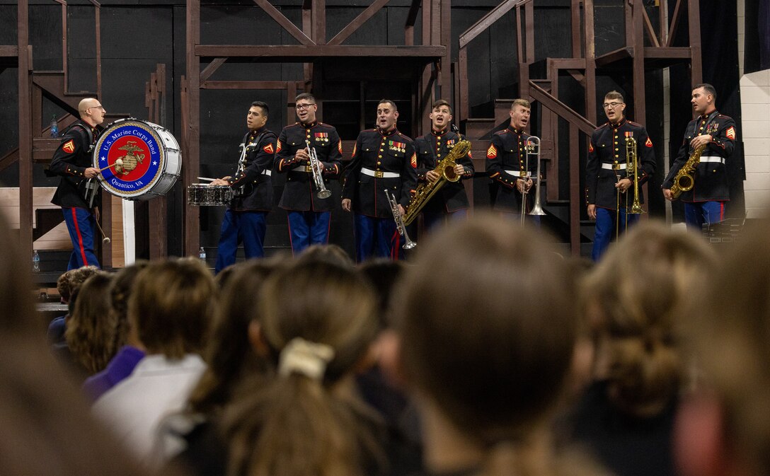 U.S. Marines with the Quantico Marine Corps Brass Band perform a concert at Norfolk Christian Schools in Norfolk, Virginia, April 17, 2023. The brass band is a group of 8-12 Marines that perform jazz, swing, rock, and other styles of contemporary music for public performances in order to enhance Marine Corps recruiting and promote positive community relations. (U.S. Marine Corps Photo by Lance Cpl. Kayla LeClaire)