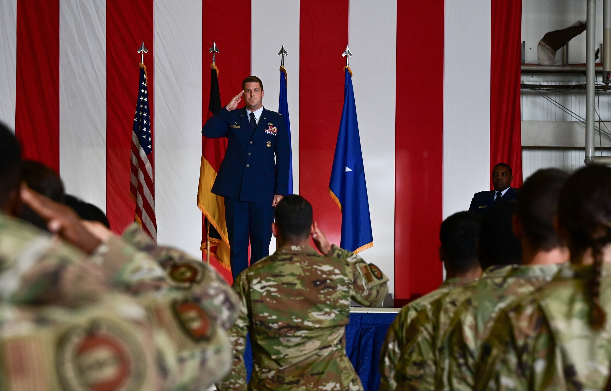 U.S. Air Force Maj. Joshua Mann, 86th Comptroller Squadron commander, renders his first salute during a change of command ceremony at Ramstein Air Base, Germany, June 28, 2023. The Airmen assigned to the 86th CPTS rendered their salute as a welcome to Mann as their new squadron commander. (U.S. Air Force photo by Senior Airman Andrew Bertain)
