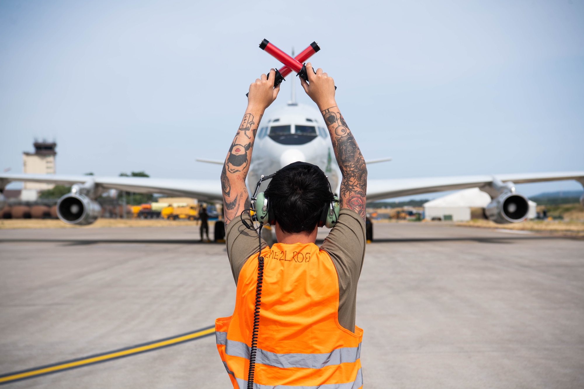 U.S. Air Force Senior Airman Yosdue Valez-Perez, 10th Expeditionary Airborne Command and Control Squadron crew chief, marshals a Northrop Grumman E-8C Joint Surveillance Target Attack Radar System aircraft at Ramstein Air Base, Germany, June 26, 2023. The JSTARS aircraft is being divested and replaced by a more advanced non-aircraft platform intended to keep Airmen safer. The divestment is a result of an ongoing effort to modernize the Air Force’s command and control capabilities.