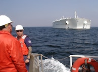 Chief Warrant Officer William Stacey, an inspector with Marine Safety Office Los Angeles, completes the an initial boarding of the world's largest double-hull ultra large crude carrier and rides back to shore aboard a water taxi.  T