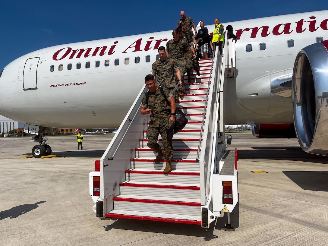 U.S. Marine Corps Maj. Zachary Isberner, financial manager, 2d Marine Expeditionary Brigade (2d MEB), loads luggage onto a bus in preparation for 2d MEB's deployment as Task Force 61/2 on Marine Corps Base Camp Lejeune, May 29, 2023. Task Force 61/2 is deployed in the U.S. Naval Forces Europe area of operations, employed by U.S. Sixth Fleet to defend U.S., allied and partner interests.