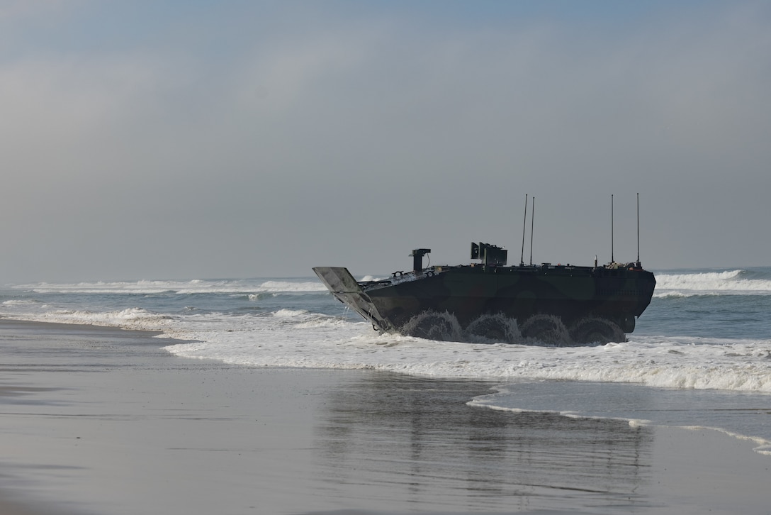 A U.S. Marine Corps Amphibious Combat Vehicle operated by Marines with the ACV Transition Training Unit drives up the beach at Marine Corps Base Camp Pendleton, California, June 21, 2023. As part of a Headquarters Marine Corps initiative the ACV TTU will certify ACV crewmembers, vehicle commanders, maintainers, and unit leadership on the safe operation, maintenance, supervision, and employment of the ACV. (U.S. Marine Corps photo by Pfc. Courtright)