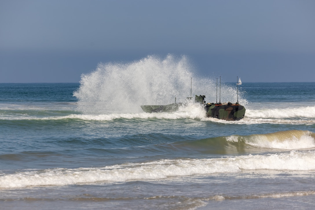 A U.S. Marine Corps Amphibious Combat Vehicle driven by Marines with the ACV Transition Training Unit enters the water at Marine Corps Base Camp Pendleton, California, June 21, 2023. As part of a Headquarters Marine Corps initiative the ACV TTU will certify ACV crewmembers, vehicle commanders, maintainers, and unit leadership on the safe operation, maintenance, supervision, and employment of the ACV. (U.S. Marine Corps photo by Pfc. Courtright)