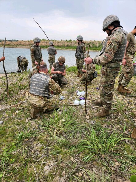 Airmen from the 5th Civil Engineering Squadron start a fire for a training event June 15, 2023 at Minot Air Force Base, North Dakota. The skills learned during this training enables Airmen to be more multi-capable and effective when deployed to an area focused on Agile Combat Employment. (Courtesy photo.)