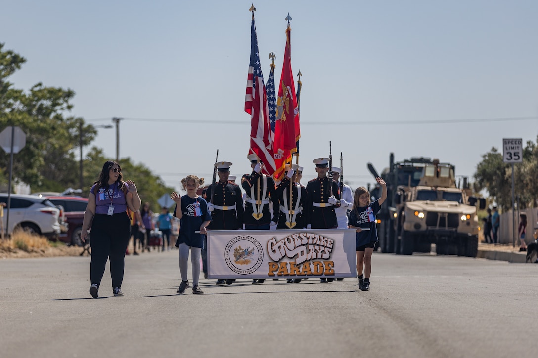 U.S. Marines and Sailors with Marine Corps Air-Ground Combat Center march down the street during the Grubstake Days Parade in Yucca Valley, California, May 27, 2023. This parade is a long-standing tradition to Yucca Valley, embracing the heritage in the community. (U.S. Marine Corps photo by Lance Cpl. Richard PerezGarcia)