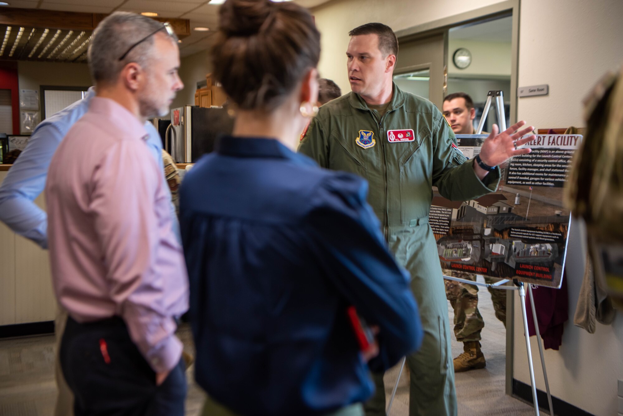 U.S. Air Force Lt. Col. Darrell Gibson, 91st Missile Wing,  740th Missile Squadron commander, gives North Dakota state staff delegates a tour of a Missile alert facility at North Dakota, June 26, 2023. Each of the three missile squadrons in the 91st Missile Wing is responsible for 50 missiles individually housed in hardened underground silos at remote launch facilities (LF), which are ready to carry out a strike 24/7. (U.S. Air Force photo by Airman 1st Class Alexander Nottingham)