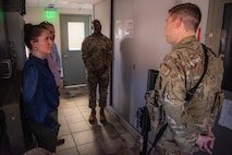 A U.S. Air Force 91st Missile Wing Security forces defender conducts a security briefing to North Dakota state staff delegates before they enter the launch control center (LCC) in North Dakota, June 26, 2023. The underground LCC contains the command and control equipment for missile operations, which remains manned by a crew 365/24/7. (U.S. Air Force photo by Airman 1st Class Alexander Nottingham)