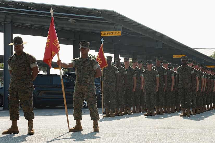 Military  in uniform stand in formation.