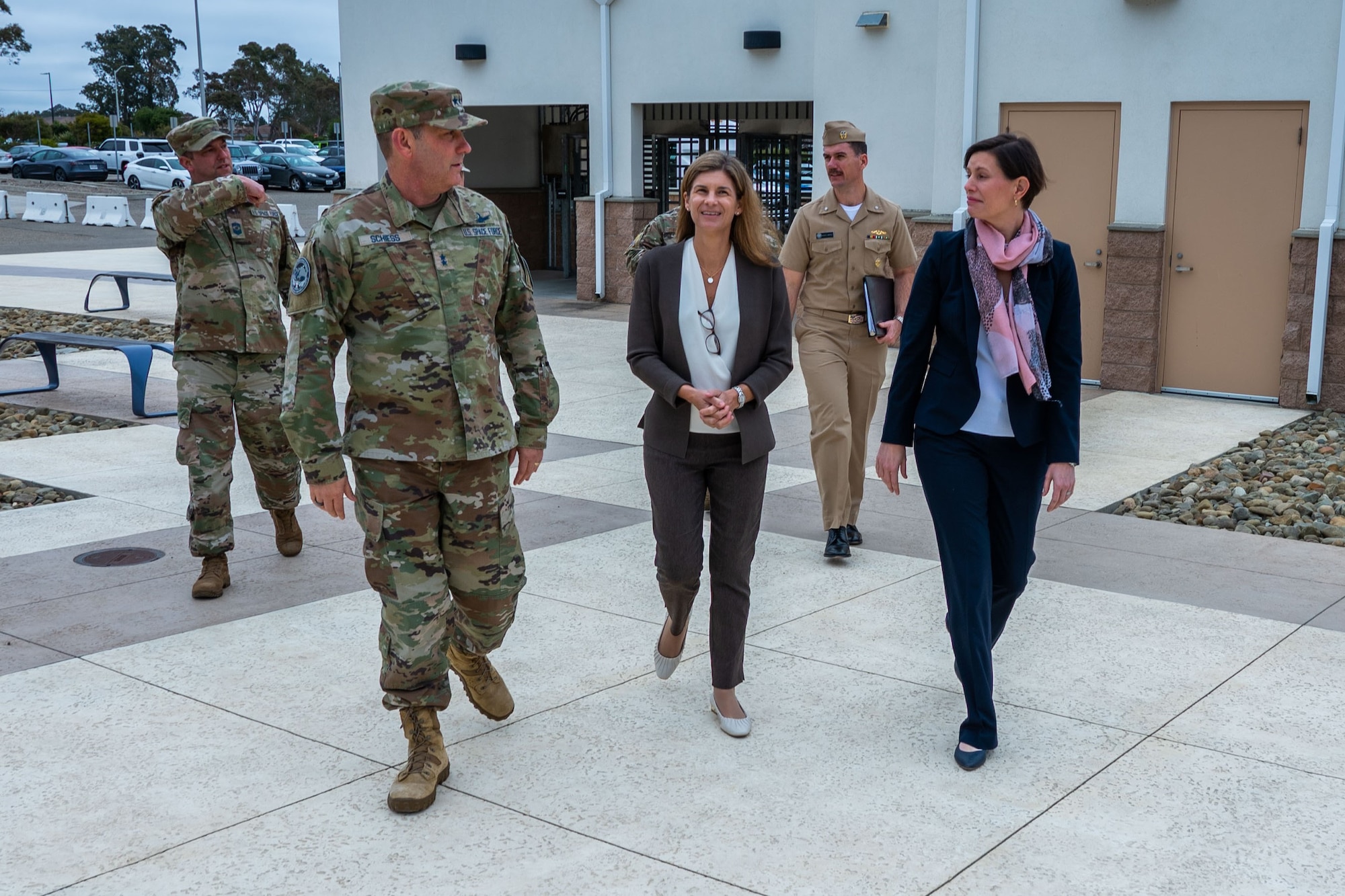 U.S. Space Force Chief Master Sgt. Grange S. Coffin, Combined Force Space Component Command (CFSCC) Senior Enlisted Leader, left, and Maj. Gen. Douglas A. Schiess, CFSCC commander, middle-left, walk with Ms. Katharine Kelley, Deputy of Space Operations for Human Capital, middle-right, and Ms. Stephanie Miller, Deputy Assistant Secretary of Defense for Military Personnel Policy, right, at the CFSCC Headquarters on Vandenberg Space Force Base, Calif., June 27, 2023. (U.S. Space Force photo by Tech. Sgt. Luke Kitterman)