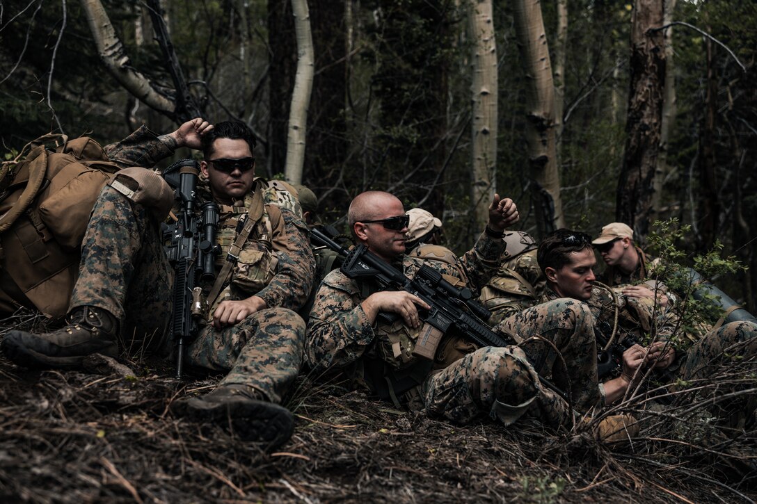 U.S. Marines with 4th Reconnaissance Battalion, 4th Marine Division, break from patrolling during Mountain Exercise (MTX) 4-23 at Marine Corps Mountain Warfare Training Center, Bridgeport, California, June 11, 2023. MTX is designed to enhance maneuver capabilities, the conduct of expeditionary advanced base operations and logistical supply and support operations in an austere environment in accordance with Force Design 2030. (U.S. Marine Corps photo by Lance Cpl. Richard PerezGarcia)