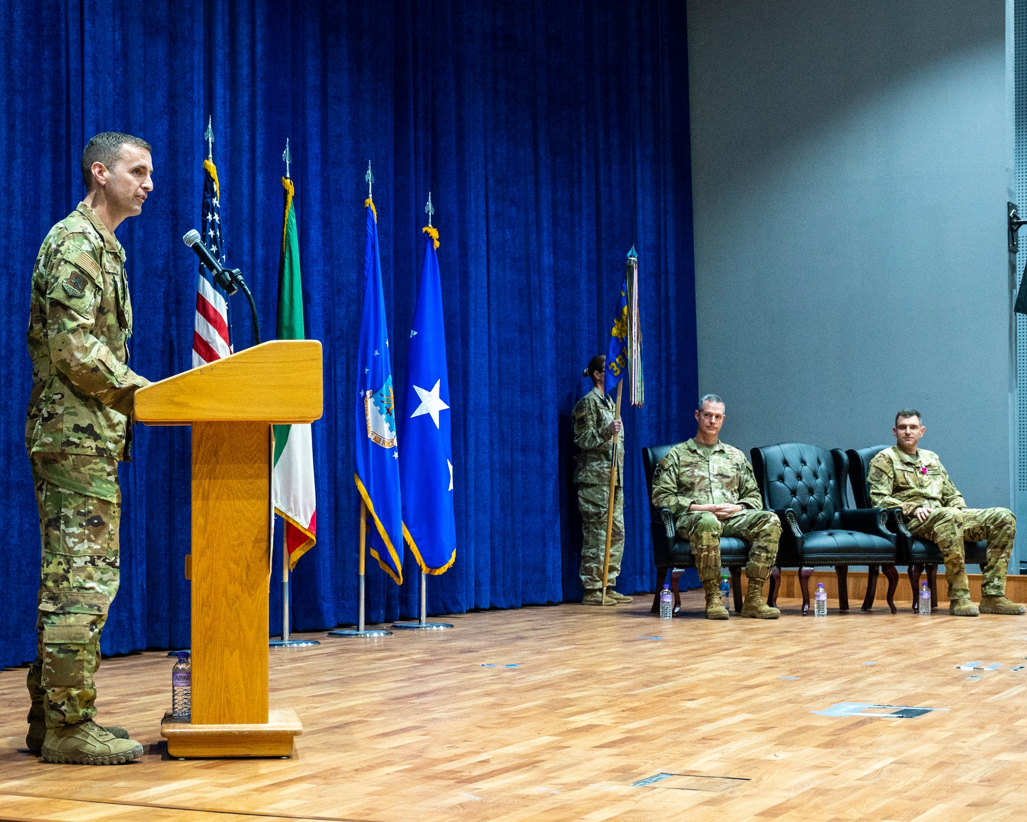 U.S. Air Force Col. Rhett Brown, 387th Air Expeditionary Group commander, addresses his new squadron during a change of command ceremony at Ali Al Salem Air Base, Kuwait, June 30, 2023.