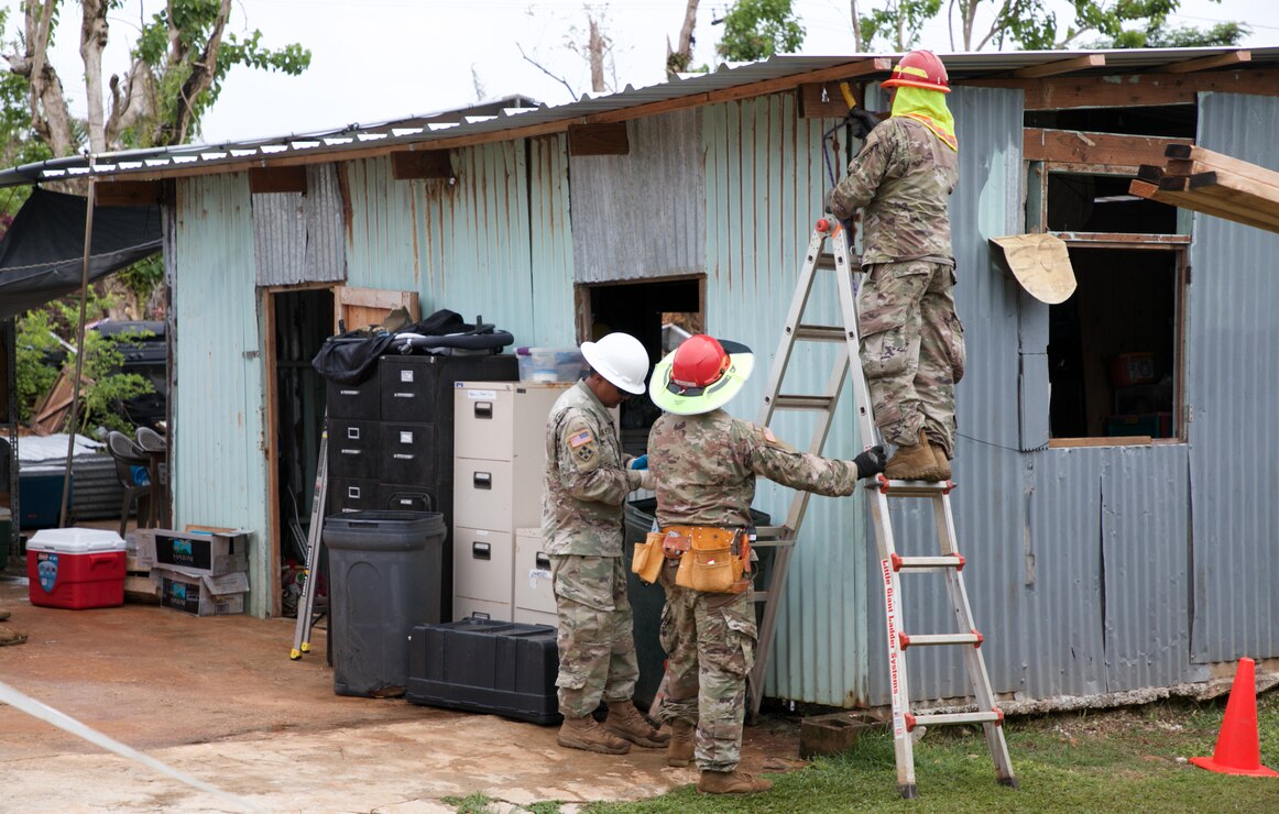 As part of recovery efforts following Typhoon Mawar’s landfall last month, Service members install the 100th temporary, emergency roof as part of the Roofing Installation Support Emergency Utilization Program (RISEUP), in Mangilao, Guam, June 27.