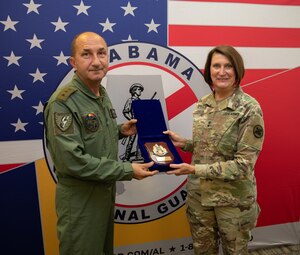 Chief of the Romanian Air Force Staff Lt. Gen. Viorel Pană and The Adjutant General of the Alabama National Guard U.S. Army Maj. Gen. Sheryl Gordon, exchange gifts June 29, 2023, at the Joint Forces Headquarters of the Alabama National Guard. This year marks the 30th anniversary of the State Partnership Program between the Romanian Air Force and the State of Alabama. The state’s 187th Fighter Wing and Romanian Air Force train together on the F-16 Fighting Falcon at Dannelly Field. (Courtesy photo)