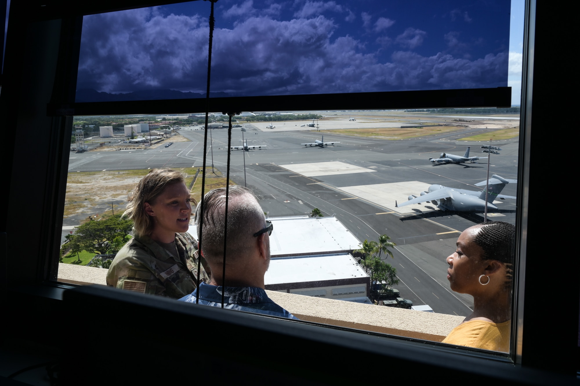 Master Sgt. Samantha Vining, 15th Operations Support Squadron airfield management superintendent, speaks to retired Army Command Sgt. Maj. John Wayne Troxell, who served as senior enlisted advisor to the chairman of the joint chiefs of staff, and Ms. Fawn Weaver, CEO and entrepreneur, during a tour of 15th Wing at Joint Base Pearl Harbor-Hickam, Hawaii, June 27, 2023. Troxell and Weaver spoke with Airmen, Sailors, Soldiers and Guardians stationed in Oahu as part of a military “Thank you” tour. (U.S. Air Force photo by Staff Sgt. Alan Ricker)