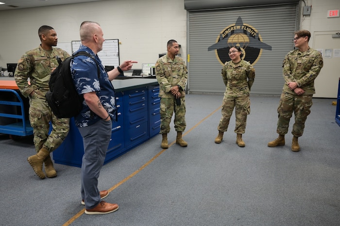Retired Army Command Sgt. Maj. John Wayne Troxell, who served as senior enlisted advisor to the chairman of the joint chiefs of staff, speaks to 15th Operations Support Squadron aircrew flight equipment Airmen during a tour of 15th Wing at Joint Base Pearl Harbor-Hickam, Hawaii, June 27, 2023. Troxell and Weaver held three different briefs, giving enlisted Airmen from all tiers a chance to learn and share their own perspectives on leadership. (U.S. Air Force photo by Staff Sgt. Alan Ricker)