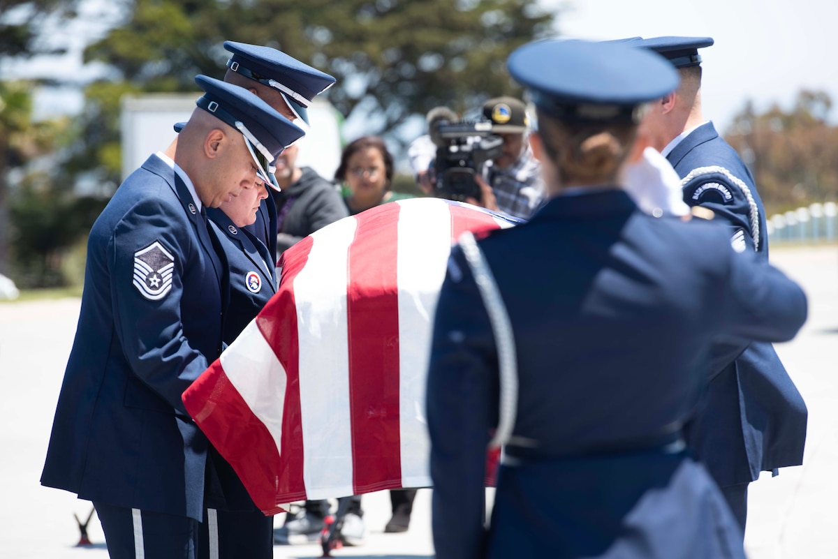 U.S. Airmen from the 60th Air Mobility Wing Honor Guard conduct a funeral for U.S. Air Force Col. Ernest L. De Soto at Golden Gate National Cemetery, San Bruno, California, June 30, 2023. De Soto was accounted for by the Defense POW/MIA Accounting Agency on March 23, 2023, and returned to his family for burial with full military honors. (U.S. Air Force photo by Senior Airman Alexander Merchak)