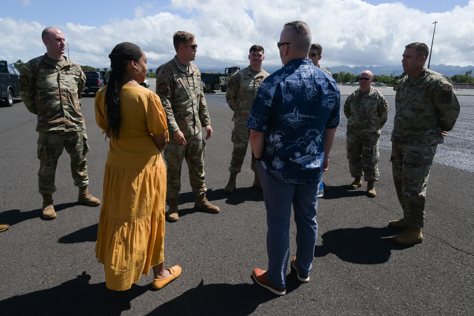 Retired Army Command Sgt. Maj. John Wayne Troxell, who served as senior enlisted advisor to the chairman of the joint chiefs of staff, and Ms. Fawn Weaver, CEO and entrepreneur, speak to Airmen assigned to the 647th Civil Engineer Squadron during a tour of 15th Wing at Joint Base Pearl Harbor-Hickam, Hawaii, June 27, 2023. Troxell and Weaver gifted a select few Airmen with a signed book and a challenge coin for their hard work and efforts. (U.S. Air Force photo by Staff Sgt. Alan Ricker)