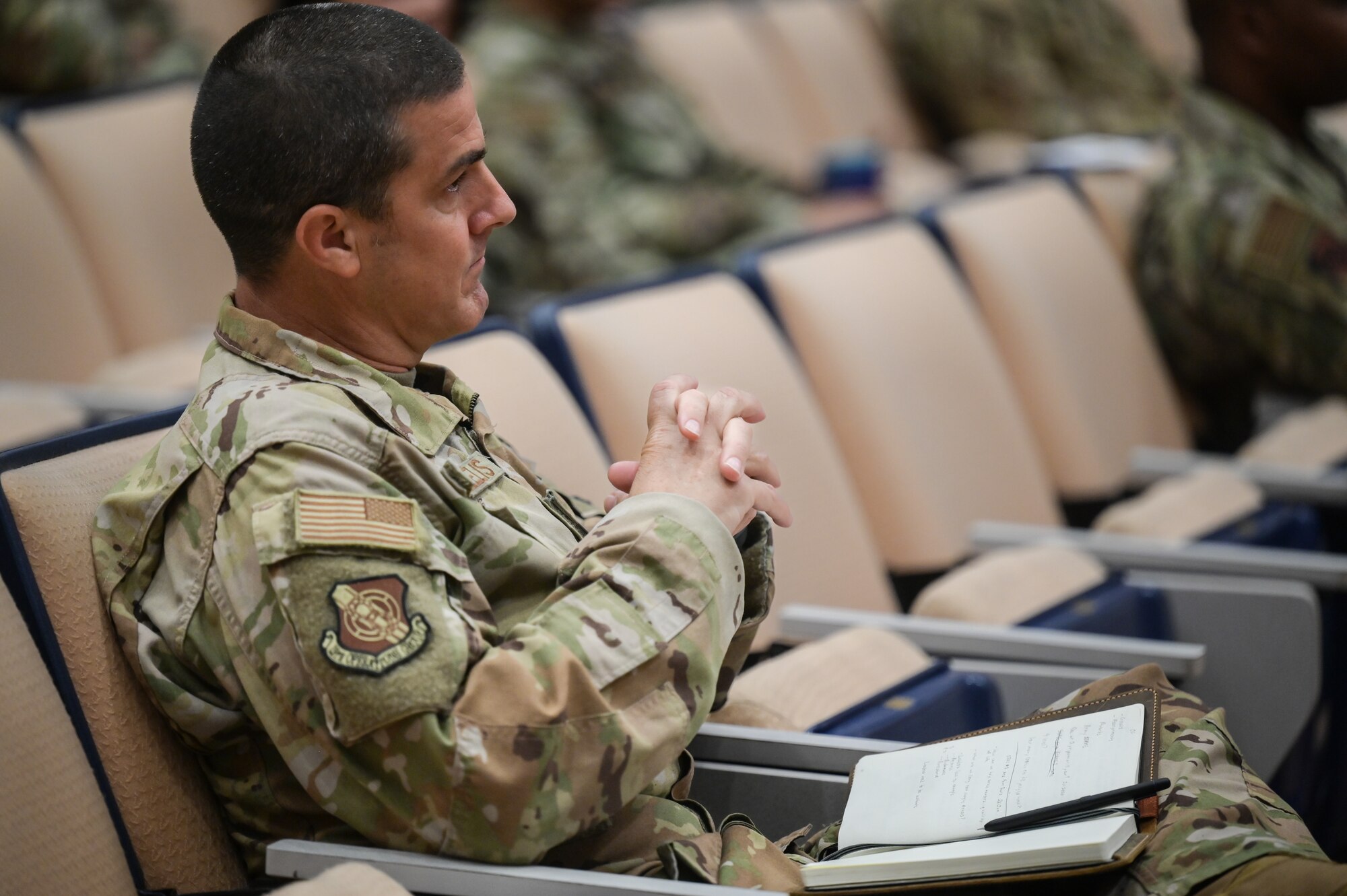 Chief Master Sgt. Sebastian Deangelis, 15th Operations Group senior enlisted leader, attends a brief led by retired Army Command Sgt. Maj. John Wayne Troxell, who served as senior enlisted advisor to the chairman of the joint chiefs of staff, and Ms. Fawn Weaver, CEO and entrepreneur, at Joint Base Pearl Harbor-Hickam, Hawaii, June 27, 2023. Troxell and Weaver provided insights on their views of leadership and held questions and answer sessions, engaging leaders from all enlisted tiers and encouraging them to share their own perspectives. (U.S. Air Force photo by Staff Sgt. Alan Ricker)
