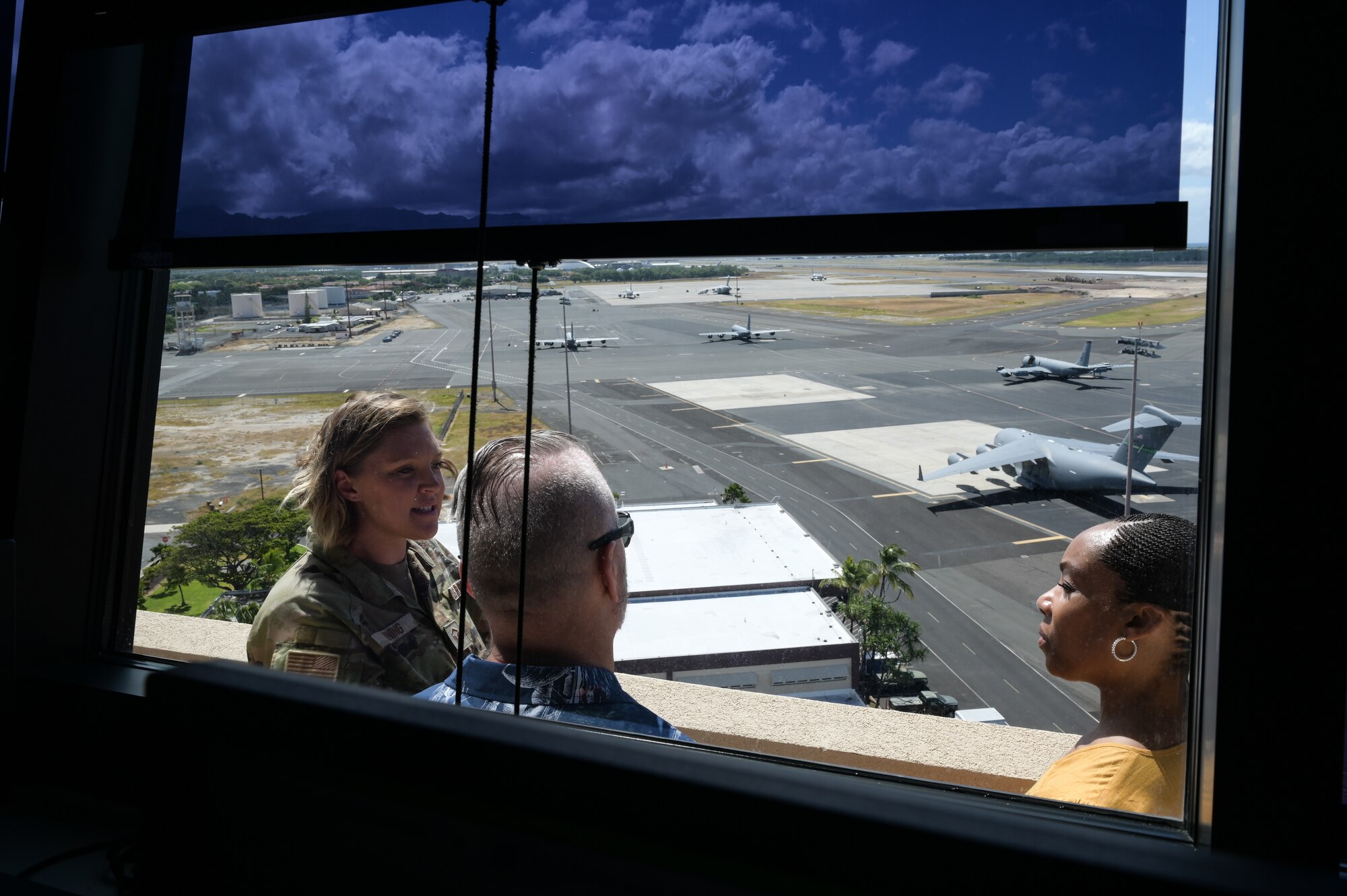 Master Sgt. Samantha Vining, 15th Operations Support Squadron airfield management superintendent, speaks to retired Army Command Sgt. Maj. John Wayne Troxell, who served as senior enlisted advisor to the chairman of the joint chiefs of staff, and Ms. Fawn Weaver, CEO and entrepreneur, during a tour of 15th Wing at Joint Base Pearl Harbor-Hickam, Hawaii, June 27, 2023. Troxell and Weaver spoke with Airmen, Sailors, Soldiers and Guardians stationed in Oahu as part of a military “Thank you” tour. (U.S. Air Force photo by Staff Sgt. Alan Ricker)