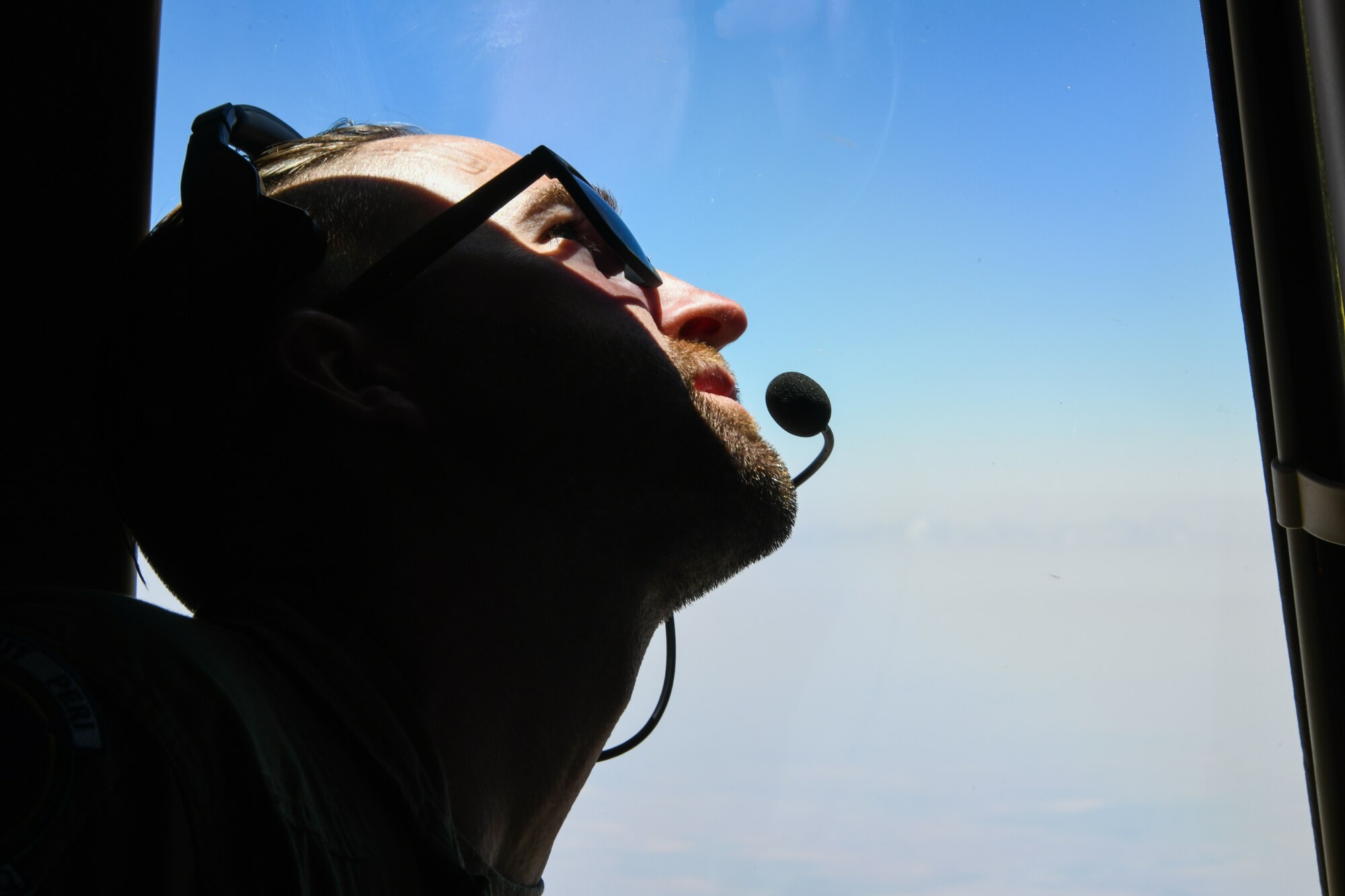 U.S. Air Force Tech. Sgt. Ian Sweaney, 56th Air Refueling Squadron instructor boom operator,gauges the position of a KC-135 Stratotanker boom during the air refueling centennial flyover inTexas and Oklahoma, June 27, 2023. The first successful air refueling mission occurred500-feet over Rockwell Air Field in San Diego, California, June 27, 1923. (U.S. Air Force photoby Airman 1st Class Miyah Gray)