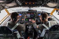 Photo of Airmen flying a jet