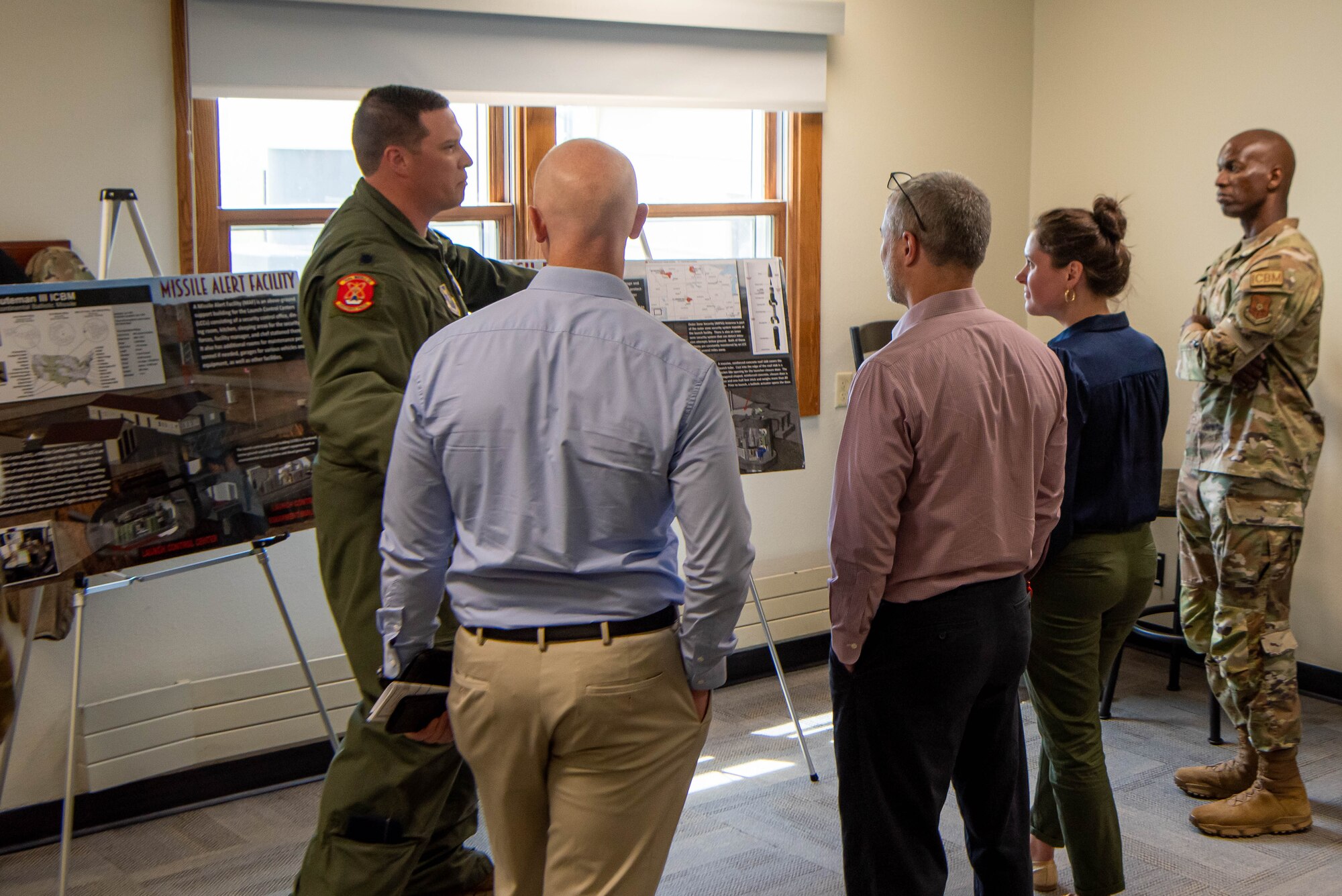 U.S. Air Force Lt. Col. Darrell Gibson,  740th Missile Squadron commander, gives North Dakota state staff delegates a tour of a missile alert facility (MAF) in North Dakota, June 26, 2023. Each of the three missile squadrons in the 91st Missile Wing is responsible for 50 missiles individually housed in hardened underground silos at remote launch facilities (LF), which are ready to carry out a strike 24/7. (U.S. Air Force photo by Airman 1st Class Alexander Nottingham)