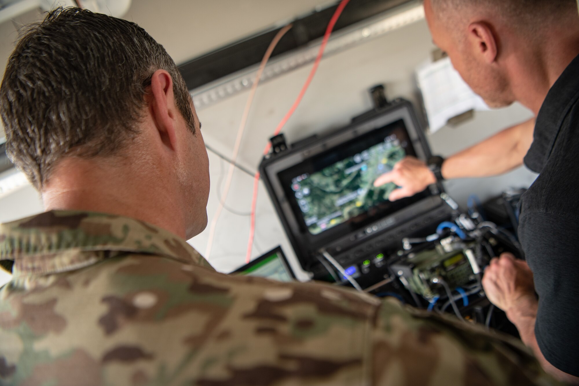 U.S. Air Force Master Sgt. Paul Hebb, left, operations superintendent, and Senior Master Sgt. Nicholas Altgilbers, senior enlisted leader, both with the 146th Air Support Operations Squadron, 137th Special Operations Wing, Oklahoma National Guard monitor data transmissions in a mobile tactical operations center during exercise Air Defender 2023 (AD23) in Germany June 19, 2023. Exercise AD23 is a German-led exercise that integrates both U.S. and Allied air-power to defend shared values, while leveraging and strengthening vital partnerships to deter aggression around the world. (U.S. Air National Guard photo by Tech. Sgt. Brigette Waltermire)