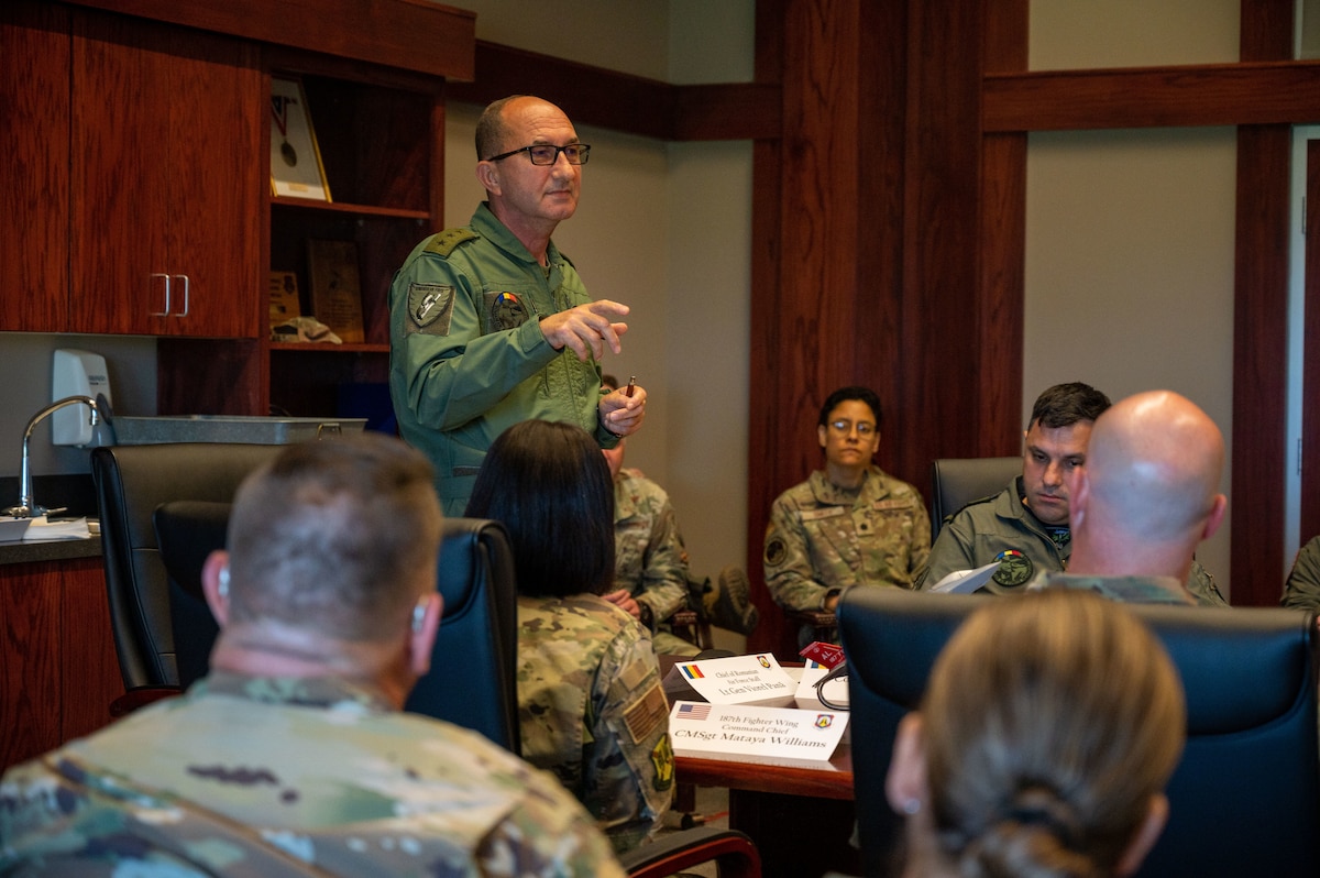 Chief of the Romanian Air Force Staff Lt. Gen. Viorel Pană addresses a room of Romanian and U.S. Airmen from the 187th Fighter Wing at Dannelly Field, Ala., June 29, 2023. The 187th has hosted a State Partnership Program with the Romanian Air Force since 1993. The partnership has supported F-16 Fighting Falcon training between both air forces, along with the professional development of Airmen in all career fields who make that mission possible. (U.S. Air Force photo by 1st Lt. Michael Luangkhot)
