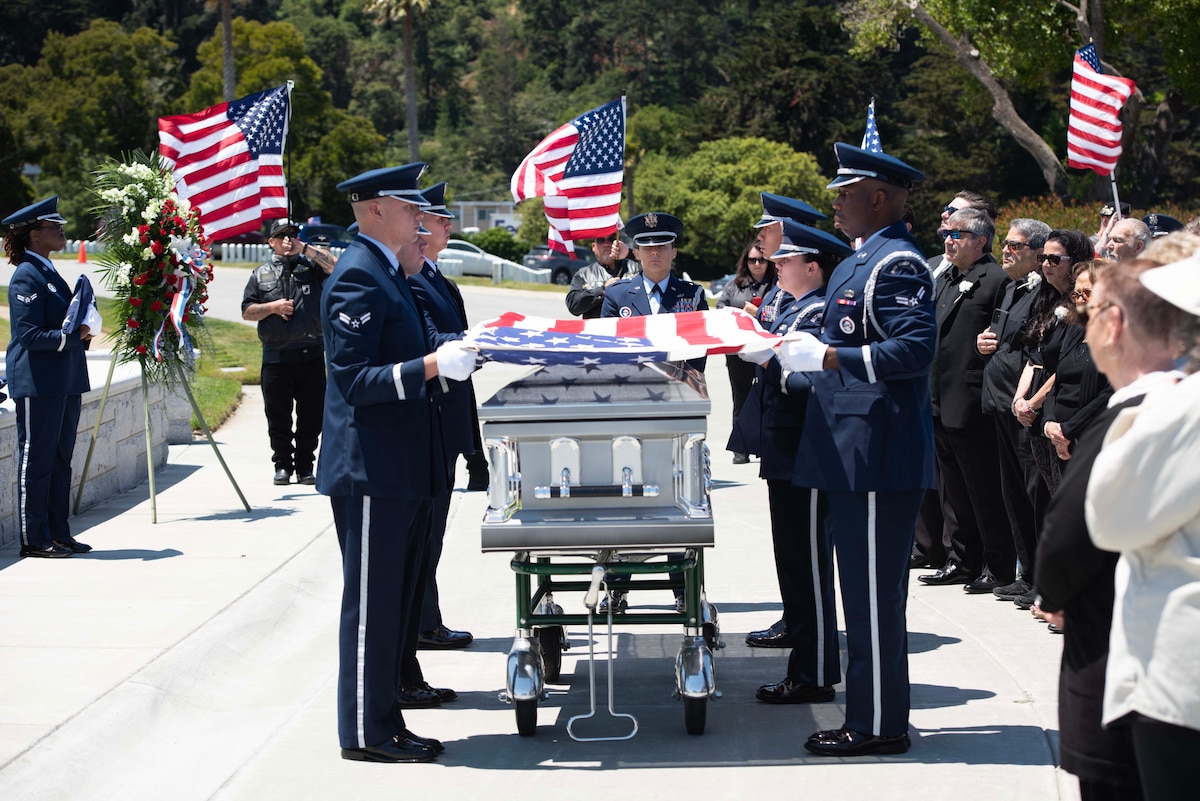 U.S. Airmen from the 60th Air Mobility Wing Honor Guard conduct a funeral for U.S. Air Force Col. Ernest L. De Soto at Golden Gate National Cemetery, San Bruno, California, June 30, 2023. De Soto was accounted for by the Defense POW/MIA Accounting Agency on March 23, 2023, and returned to his family for burial with full military honors. (U.S. Air Force photo by Senior Airman Alexander Merchak)