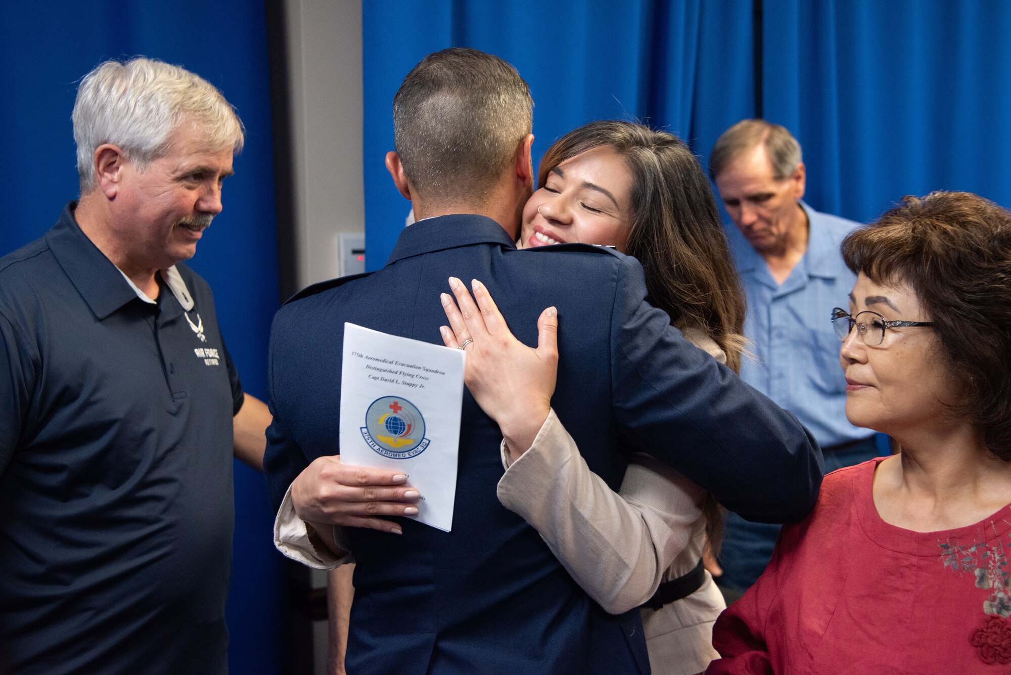 Capt. David Stuppy Jr. hugs a family member.