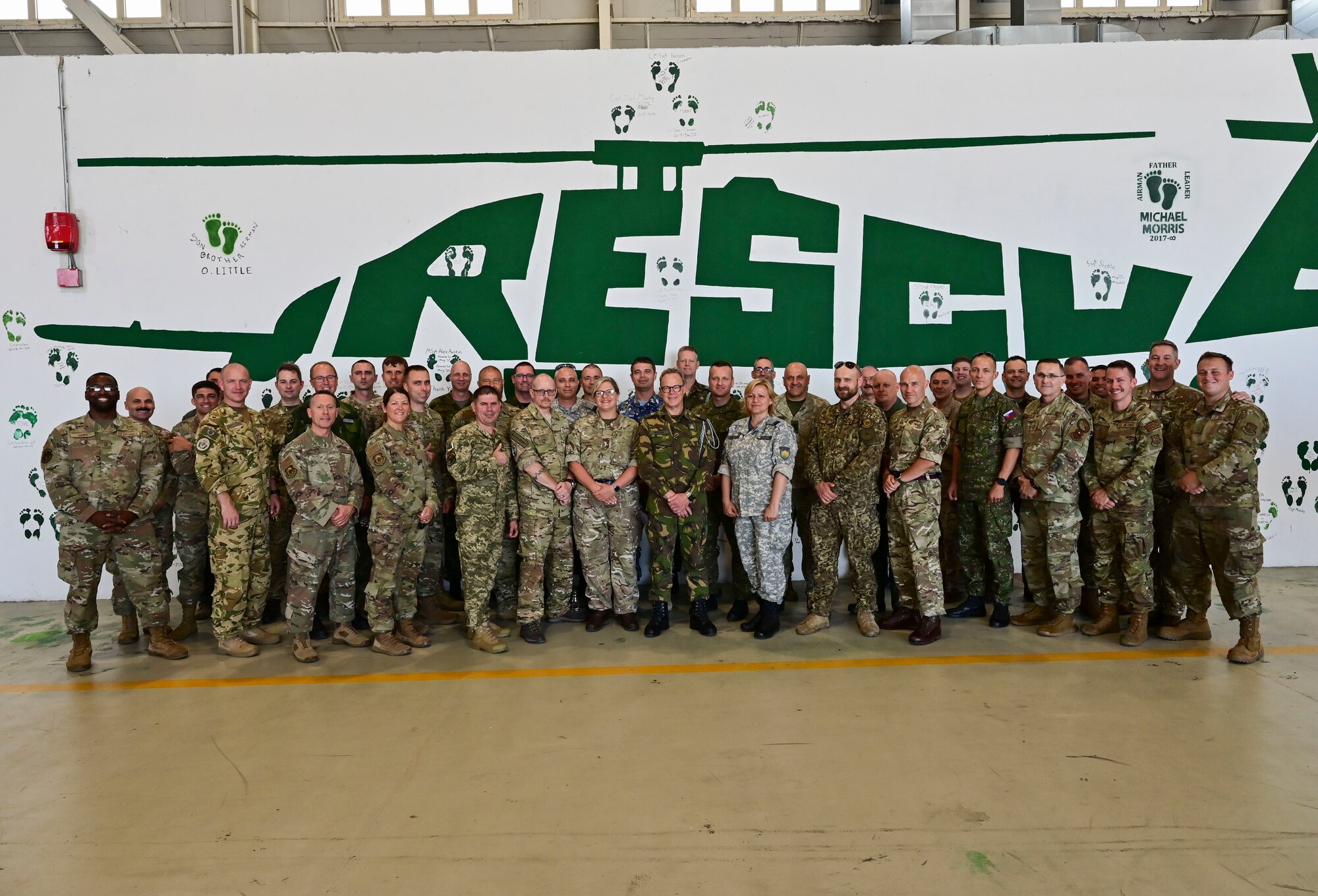 A group of senior leaders pose for a photo