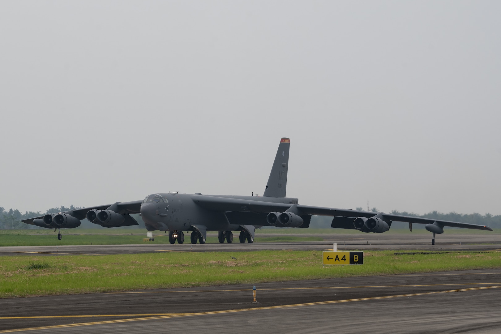 A U.S. Air Force B-52H Stratofortress assigned to the 23rd Bomb Squadron at Minot Air Force Base, North Dakota, prepares to take off in support of a bilateral military training exercise at the Kualanamu International Airport in Medan, Indonesia, June 21, 2023. Bomber deployments and operations enhance the readiness and training necessary to respond to any contingency or challenge across the globe. This particular training flight marked the first time a U.S. Air Force B-52 had taken off from Indonesian soil. (U.S. Air Force photo by Tech. Sgt. Zade Vadnais)