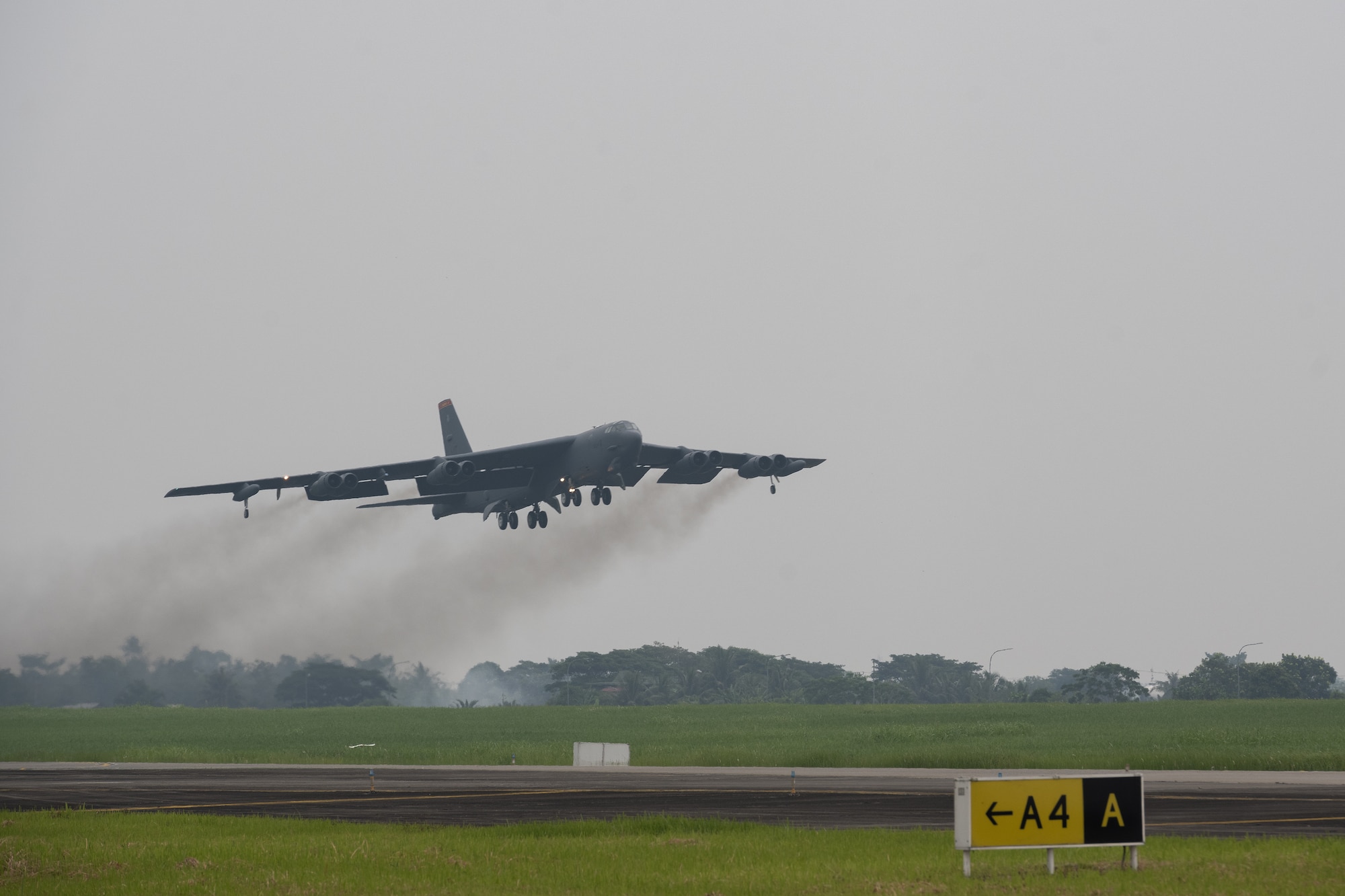 A U.S. Air Force B-52H Stratofortress assigned to the 23rd Bomb Squadron at Minot Air Force Base, North Dakota, takes off in support of a bilateral military training exercise at the Kualanamu International Airport in Medan, Indonesia, June 21, 2023. Bomber deployments and operations like this enable crews to maintain a high state of readiness and proficiency, and validate the U.S. Air Force’s always-ready, global strike capability. This particular training flight marked the first time a U.S. Air Force B-52 had taken off from Indonesian soil. (U.S. Air Force photo by Tech. Sgt. Zade Vadnais)