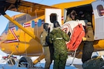 Airmen from the 109th Airlift Wing’s Polar Camp Skiway Team and members from the 440 Transport Squadron, Royal Canadian Armed Forces, load equipment and fuel into a Twin Otter aircraft at Resolute Bay, Nunavut, Canada, Feb. 27, 2023, to prepare for Exercise Guerrier Nordique. The Vermont National Guard is also participating in the exercise.