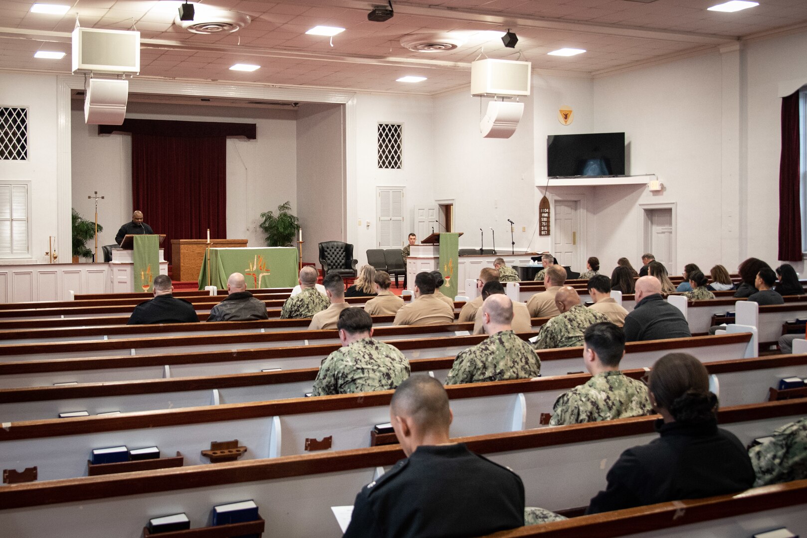 Chief Petty Officer Raymond Weeks speaks during a memorial ceremony celebrating the life of the late Hospitalman Luigi D. Giovanni held Thursday, February 2 at the Marine Corps Air Station Cherry Point Chapel.  Giovanni served aboard the clinic as a Pharmacy Technician prior to his passing late January, 2023.