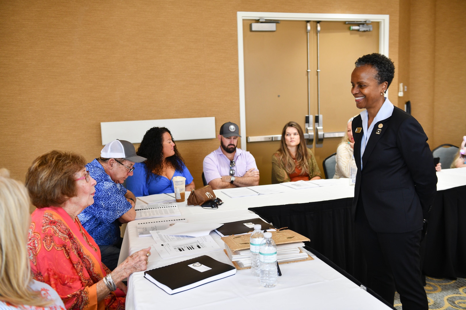 Mrs. Fern Sumpter Winbush, Defense POW/MIA Accounting Agency (DPAA), principal deputy director, greets family members of U.S. Army Air Forces 2nd Lt. Pharis E. Weekley during an identification briefing in Orlando, Florida, Feb. 25, 2023. Weekley was a navigator assigned to the 329th Bombardment Squadron when the B-24 Liberator aircraft on which he was serving was hit by enemy anti-aircraft fire on Aug. 1, 1943. The aircraft then crashed north of Bucharest, Romania and his remains were not identified following the war. Weekley was accounted for on July 12, 2022, nearly 80 years after his unit’s aircraft was attacked. (U.S. Air Force photo by Staff Sgt. Jonathan McElderry)