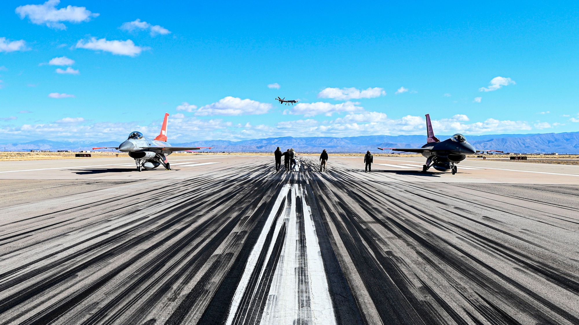 Two QF-16 Vipers from the 82nd Aerial Targets Squadron Detachment 1, prepare to take off on the runway at Holloman Air Force Base, New Mexico, Feb. 22, 2023. The 82nd ATRS is responsible for providing QF-16s for customers system tests that require aerial targets for weapons testing. (U.S. Air Force photo by Airman 1st Class Isaiah Pedrazzini)