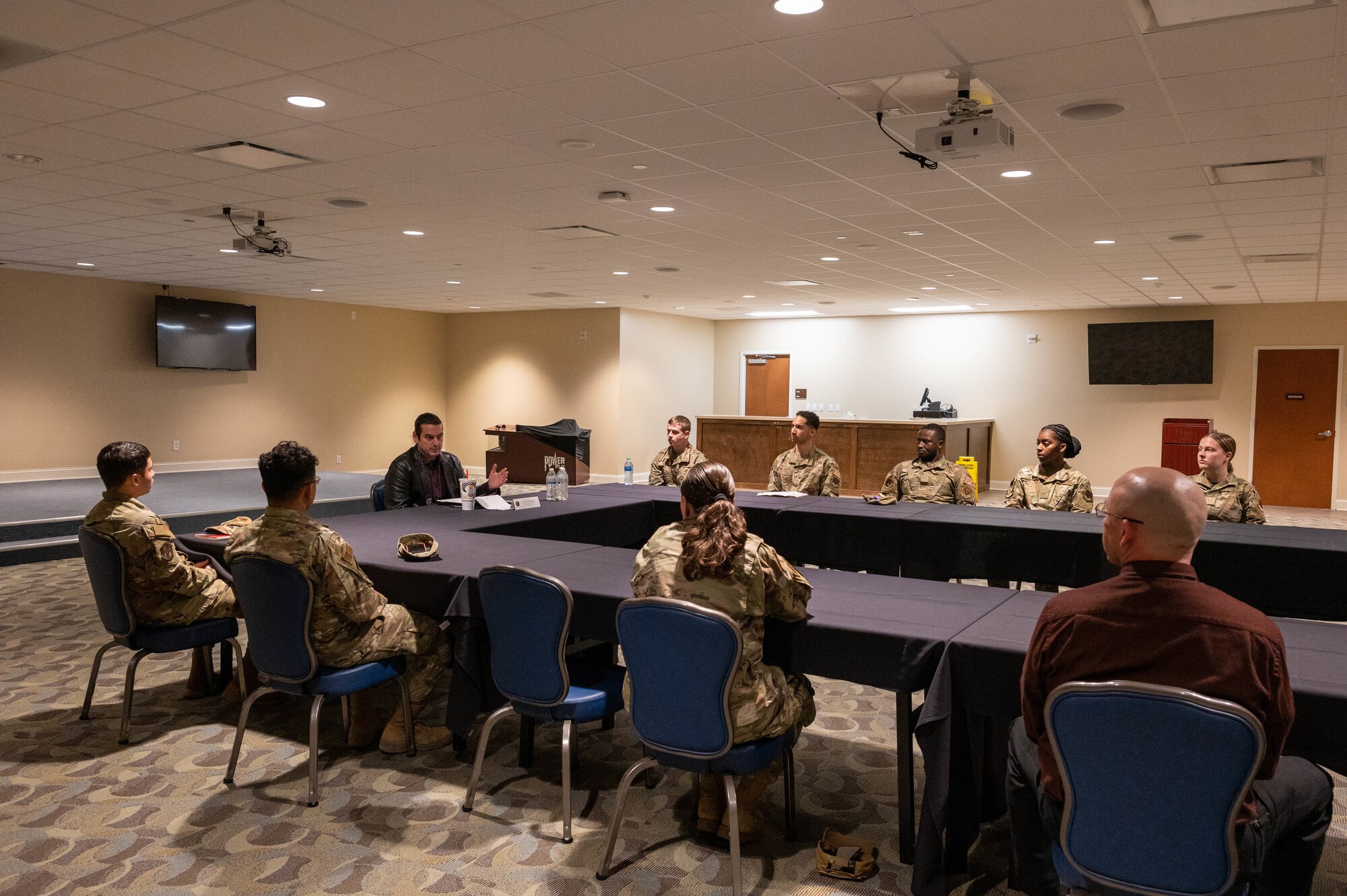 Kiya Batmanglidj, House Appropriations committee member, engages with Airmen assigned to the 4th Fighter Wing during a junior enlisted panel at Seymour Johnson Air Force Base, North Carolina, Feb. 23, 2023. During the panel the  staff delegate Batmanglidj engaged with Airmen and heard their concerns. (U.S. Air Force photo by Senior Airman Taylor Hunter)