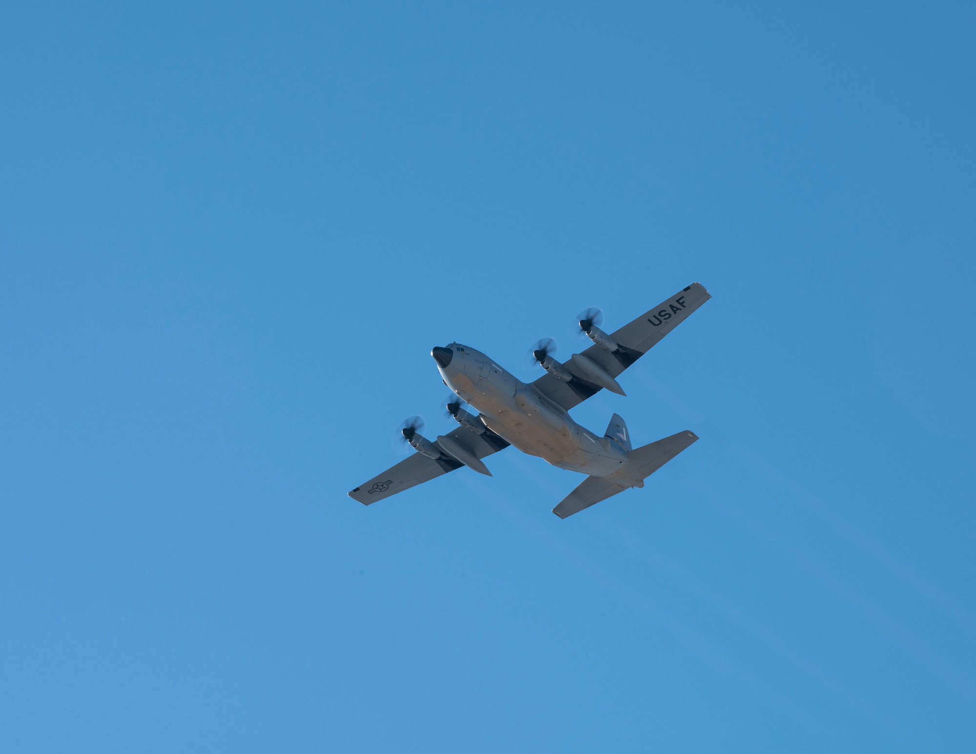 A C-130 Hercules from the 133rd Airlift Wing flies over the base during U.S. Air Force Col. James Cleet, 133rd Airlift Wing commander, fini-flight in St. Paul, Minn., Feb. 13, 2023.