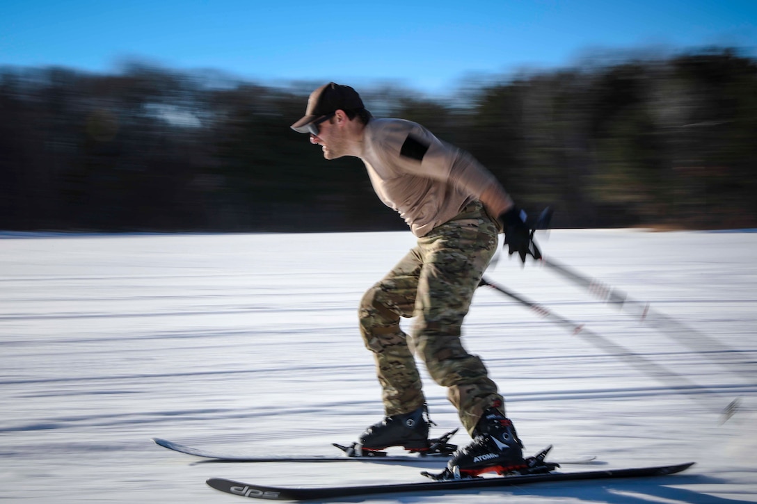 A sailor skis across a flat area covered with snow.