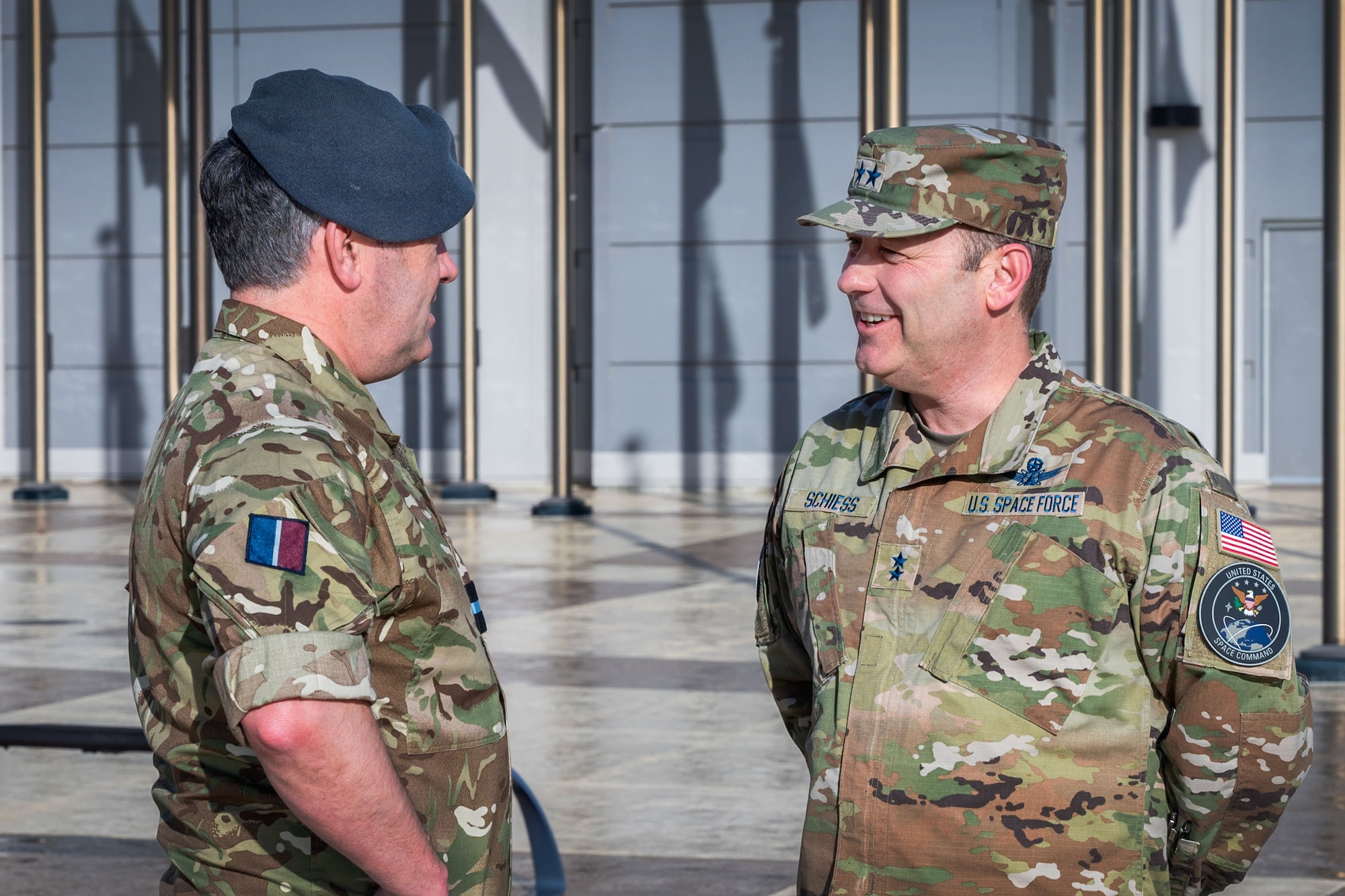 U.K. Royal Air Force Air Commodore Adam Bone, U.K. Space Command (UKSPACECOM) director of operations, plans and training, meets with U.S. Space Force Maj. Gen Douglas A. Schiess, Combined Force Space Component Command (CFSCC) commander, at CFSCC headquarters on Vandenberg Space Force Base, Calif., Feb. 27, 2023. Bone's visit aimed to build a deeper understanding of the CFSCC, Combined Space Operations Center (CSpOC) and 18th Space Defense Squadron mission and focus areas in order to strengthen the U.S.-U.K. space partnership and enhance collaboration between the U.K. Space Operations Centers and the CSpOC. (U.S. SpaceForce photo by Tech. Sgt. Luke Kitterman)