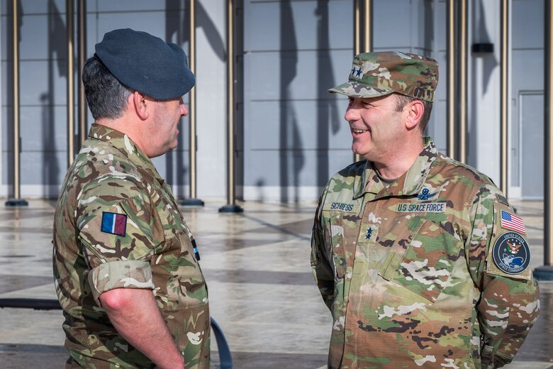 U.K. Royal Air Force Air Commodore Adam Bone, U.K. Space Command (UKSPACECOM) director of operations, plans and training, meets with U.S. Space Force Maj. Gen Douglas A. Schiess, Combined Force Space Component Command (CFSCC) commander, at CFSCC headquarters on Vandenberg Space Force Base, Calif., Feb. 27, 2023. Bone's visit aimed to build a deeper understanding of the CFSCC, Combined Space Operations Center (CSpOC) and 18th Space Defense Squadron mission and focus areas in order to strengthen the U.S.-U.K. space partnership and enhance collaboration between the U.K. Space Operations Centers and the CSpOC. (U.S. SpaceForce photo by Tech. Sgt. Luke Kitterman)