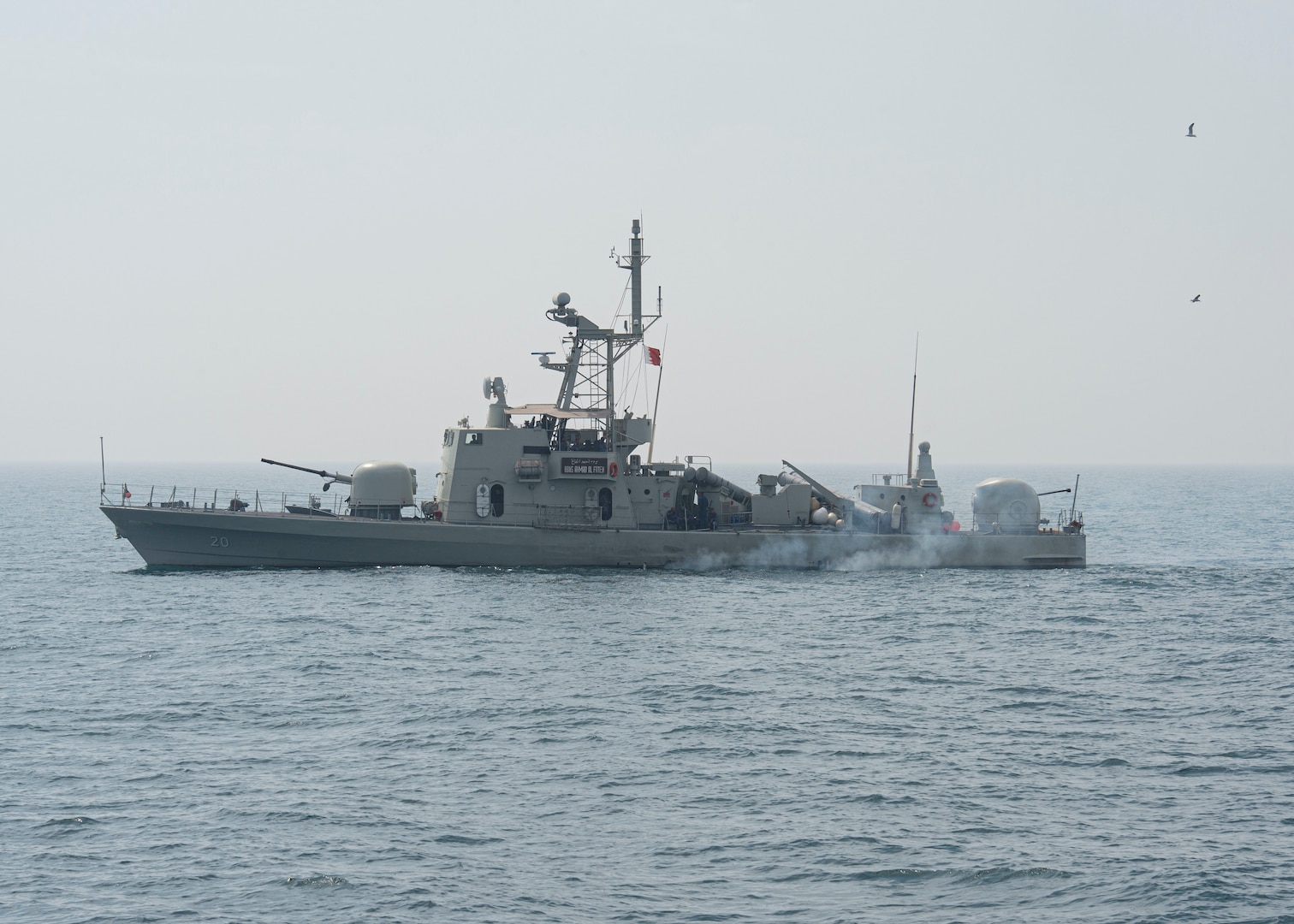 230226-N-NH267-1088 ARABIAN GULF (Feb. 26, 2023) Royal Bahrain Naval Force ship RBNS Ahmad Al Fateh (P20) sails in the Arabian Gulf near guided-missile destroyer USS Paul Hamilton (DDG 60), Feb. 26, 2023. Paul Hamilton is deployed to the U.S. 5th Fleet area of operations to help ensure maritime security and stability in the Middle East region.