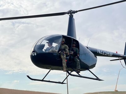 Competitors in the 2022 Chris D. Horton Memorial Sniper Competition, held in Jackson, Nebraska, prepare to shoot from a helicopter. Chris Horton was killed while serving as a sniper with the Oklahoma National Guard’s 1st Battalion of the 279 Infantry Regiment, 45th Infantry Brigade Combat Team in Paktia, Afghanistan, Sept. 9, 2011.