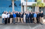 (right) Rear Adm. Kevin P. Byrne, Naval Sea Systems Command Warfare Center commander, stands with NAVSEA commanding officers, technical directors and warfare centers headquarters staff leadership from around the country during the NAVSEA Warfare Centers Leadership Team meeting in Panama City, Fla., Feb. 22 - 23. Front row (from left): Larry Tarasek, Jeff Koe, Capt. Mike Aiena, Michael Slater, Capt. Brandon Larson, Andrea Perles, Ana Gulian, Ron Vien, Dale Sisson, Brad Jordan, Dr. Peter Adair, Dr. Angie Lewis, Rear Adm. Byrne, Second row (from left): Nigel Thijs, Capt. Tony Holmes, Andy Buckon, Capt. A.P. Breksa, Gene Hackney, Dianne Costlow, Commander Christina Carino, Capt. Richard Ardolino, Capt. Duncan McKay, Dr. David Sanders, Capt. Dana Simon, Jon Legge, Beth Warner, Capt. Chad Hennings, Adam Nave, Capt. Sylvester Brown, Capt. Eric Correll, Third row (from left): Capt. David Back, Capt. Phillip Mlynarski, Capt. Todd Hutchison, Dr. Vic Ricci, Capt. Gordon Hunt, David Grande, Ken Dotson, Capt. Damian Clem, Ashley Johnson, and Mark Oesterreich.