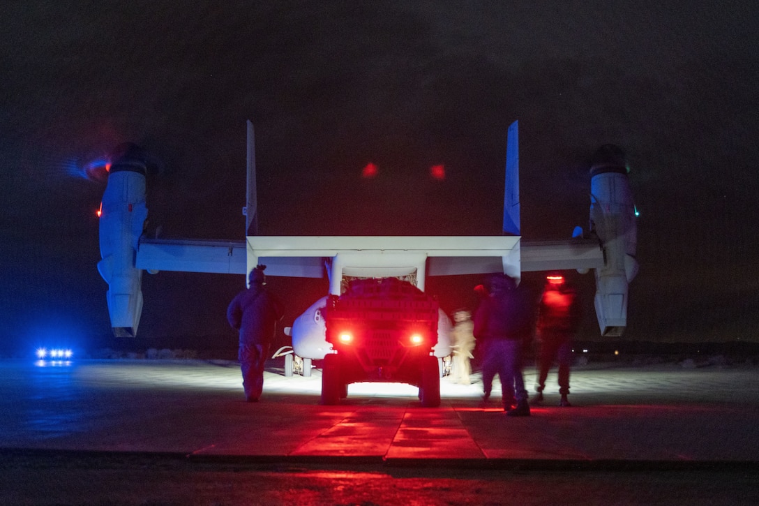 U.S. Marines with Charlie Company, 1st Reconnaissance Battalion, 1st Marine Division, load a Utility Task Vehicle onto a MV-22 Osprey assigned to Marine Medium Tiltrotor Squadron 261 (VMM-261), Marine Aircraft Group 26, 2nd Marine Aircraft Wing, during the Ground Reconnaissance Course (GRC) at Camp Wilson on Marine Corps Air Ground Combat Center, Twentynine Palms, California, Jan. 30, 2023. The GRC allowed the Marines to conduct full mission profile patrols to validate R&S tactics, techniques, and procedures in preparation for Service Level Training Exercise 2-23. (U.S. Marine Corps photo by Lance Cpl. Anna Higman)