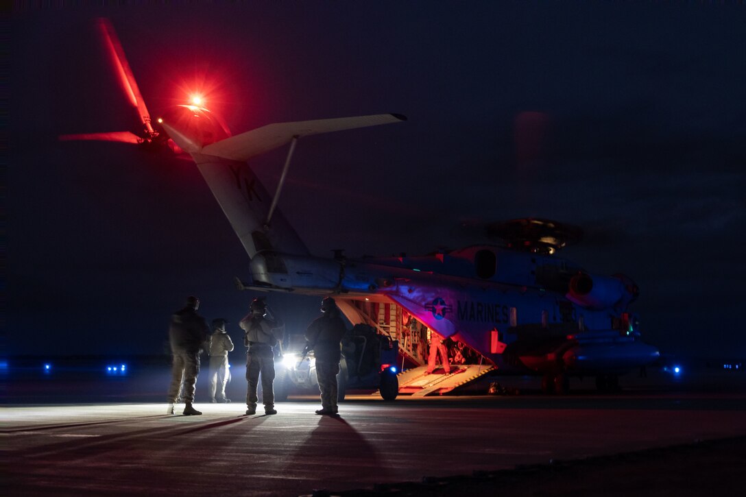 U.S. Marines with Charlie Company, 1st Reconnaissance Battalion, 1st Marine Division, load a Utility Task Vehicle onto a CH-53E Super Stallion assigned to Marine Heavy Helicopter Squadron 466 (HMH-466), Marine Aircraft Group 16, 3rd Marine Aircraft Wing, during the Ground Reconnaissance Course (GRC) at Camp Wilson on Marine Corps Air Ground Combat Center, Twentynine Palms, California, Jan. 30, 2023. The GRC allowed the Marines to conduct full mission profile patrols to validate R&S tactics, techniques, and procedures in preparation for Service Level Training Exercise 2-23. (U.S. Marine Corps photo by Lance Cpl. Anna Higman)
