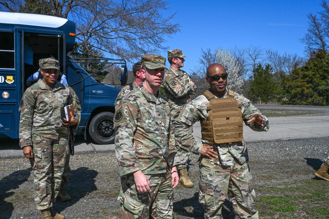 Men in uniform talk to each other.